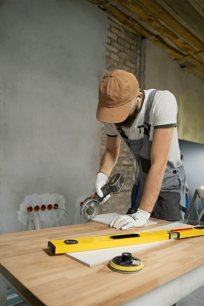 Man with saw performing home renovations 